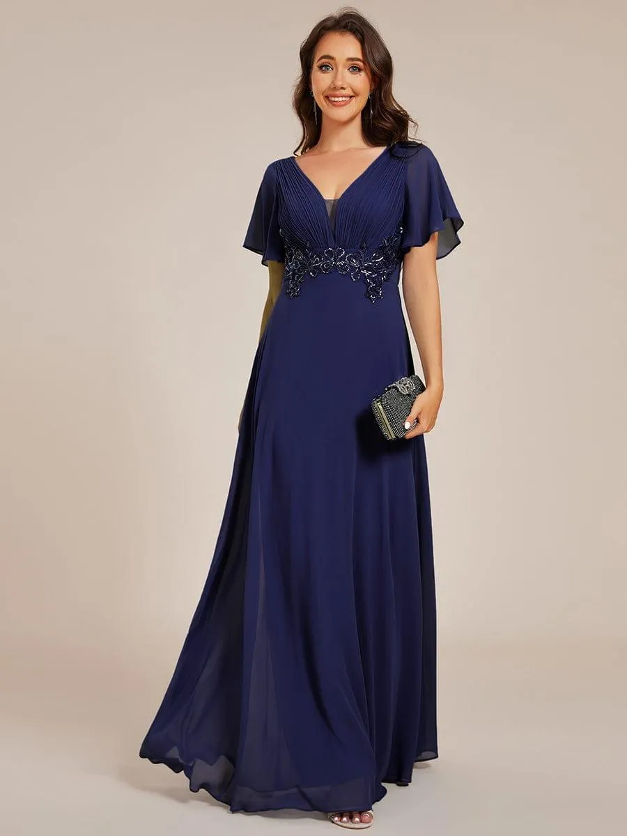 Robe de soirée longue à col en V et appliques à la taille grande taille