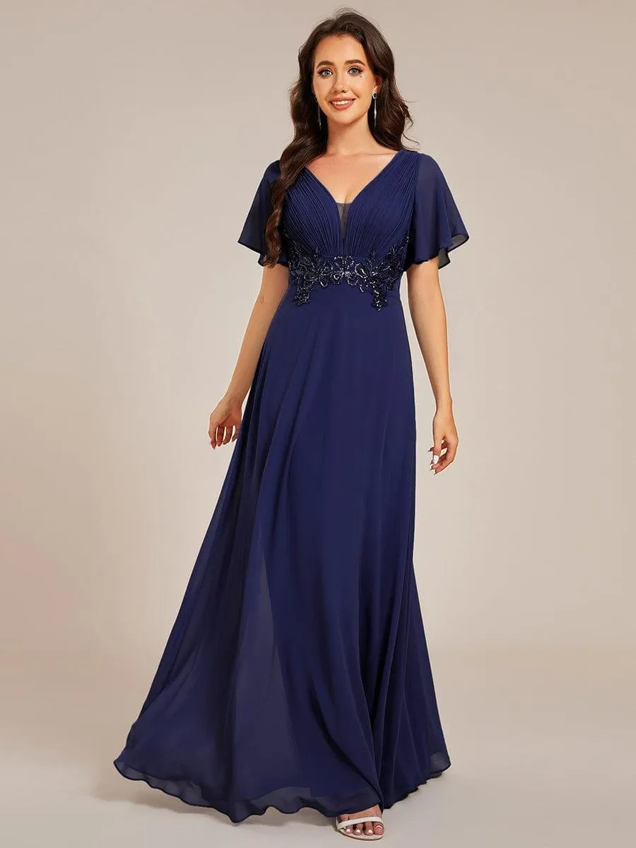Robe de soirée longue à col en V et appliques à la taille grande taille