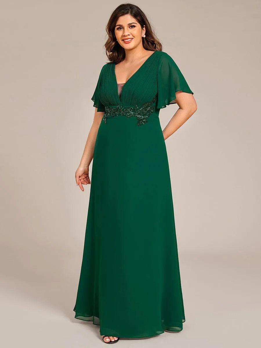 Robe de soirée longue à col en V et appliques à la taille grande taille