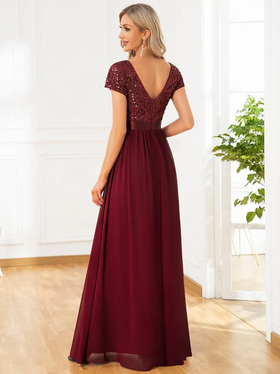 Robe de soirée taille empire à sequins et mousseline à encolure en V
